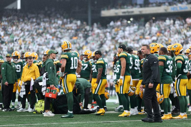 The Packers gather around an injured Jayden Reed on Sunday.