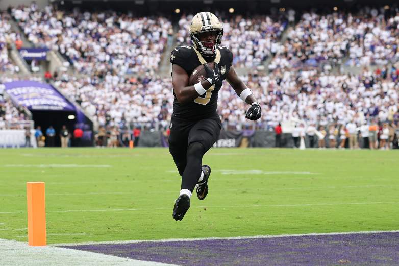 Travis Etienne runs toward the end zone for the Saints.