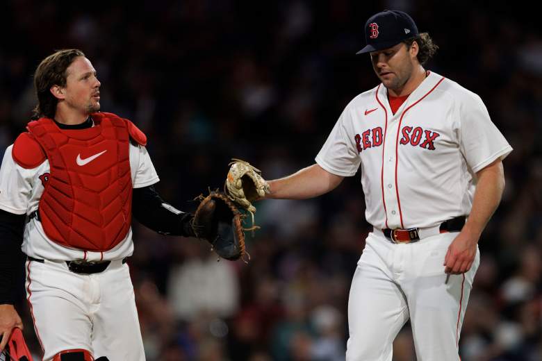 Erik Miller and Adley Rutschman walk off the field for the Red Sox.