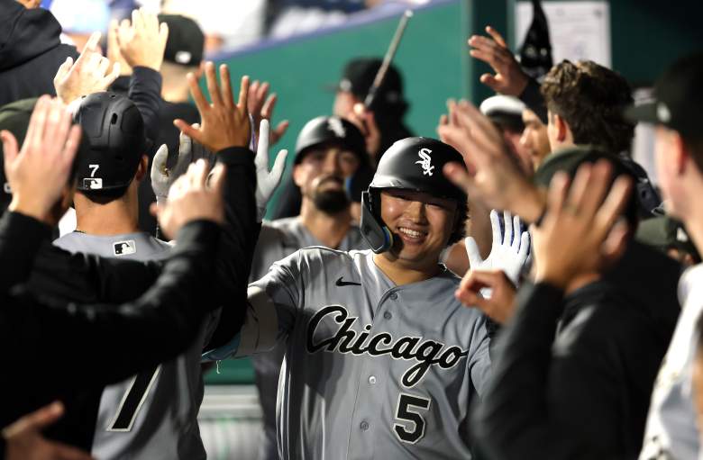 Munetaka Murakami is congratulated in the Chicago White Sox dugout.