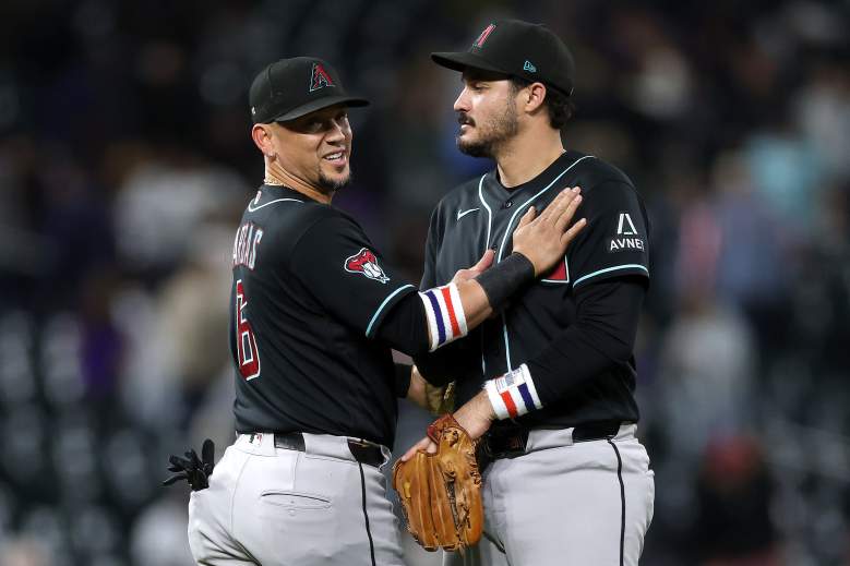 Ildemaro Vargas and Nolan Arenado celebrate for the Diamondbacks.
