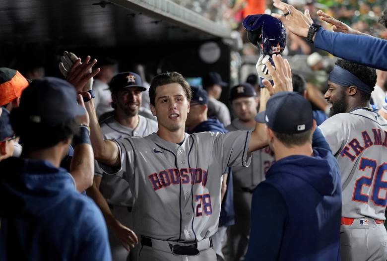 Lucas Spence is congratulated by his Astros teammates after a home run.
