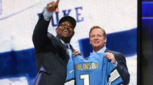 Laken Tomlinson of the Duke Blue Devils holds up a jersey with NFL Commissioner Roger Goodell after being picked #28 overall by the Detroit Lions during the first round of the 2015 NFL Draft at the Auditorium Theatre of Roosevelt University on April 30, 2015 in Chicago, Illinois.