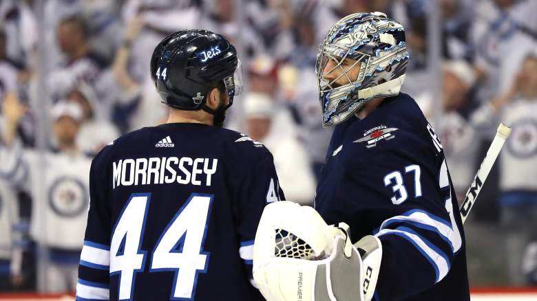 Josh Morrissey #44 and Connor Hellebuyck #37 of the Winnipeg Jets celebrate their teams win over the Vegas Golden Knights in Game One of the Western Conference Finals during the 2018 NHL Stanley Cup Playoffs at Bell MTS Place on May 12, 2018 in Winnipeg, Canada. The Winnipeg Jets defeated the Vegas Golden Knights 4-2.