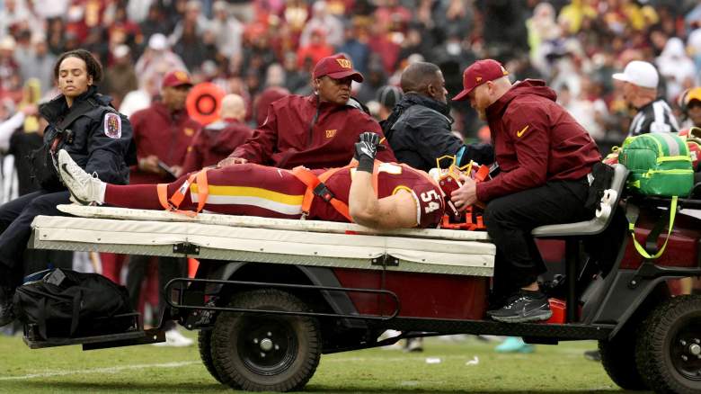 Leo Chenal #54 of the Washington Commanders is carted off the field against the Seattle Seahawks during the first half at Northwest Stadium on September 27, 2026 in Landover, Maryland