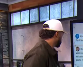 Russell Wilson&rsquo;s hairstyle seen from behind during a SetHut video appearance