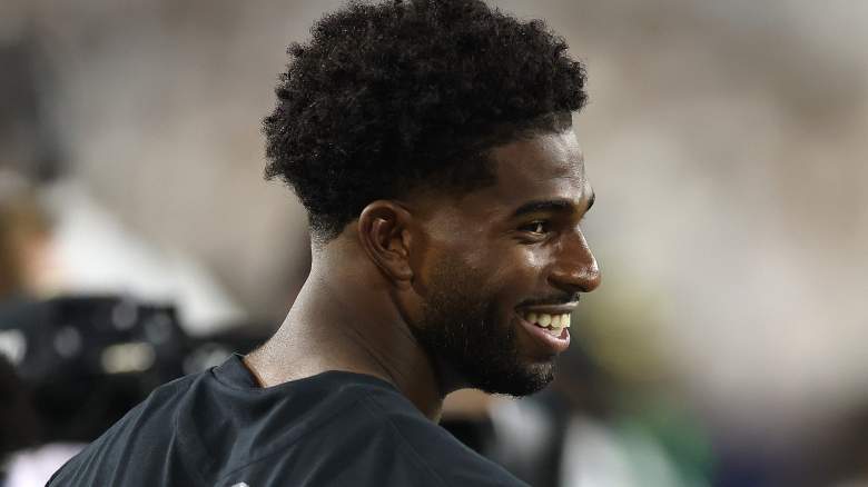 Cleveland Browns quarterback Shedeur Sanders looks on from the sidelines during a Colorado game.