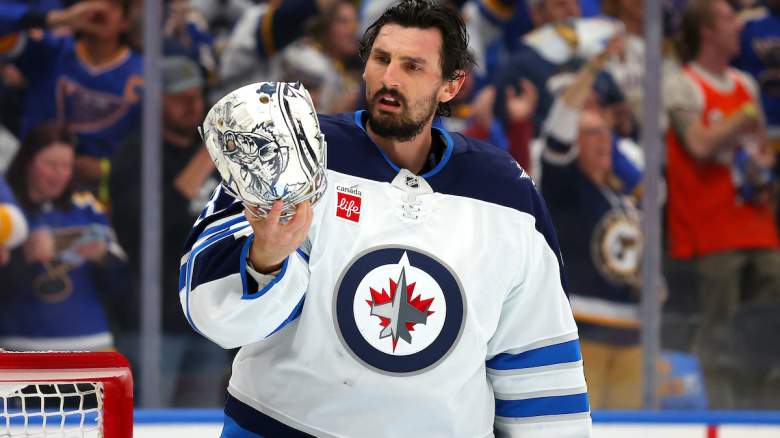Connor Hellebuyck #37 of the Winnipeg Jets reacts
