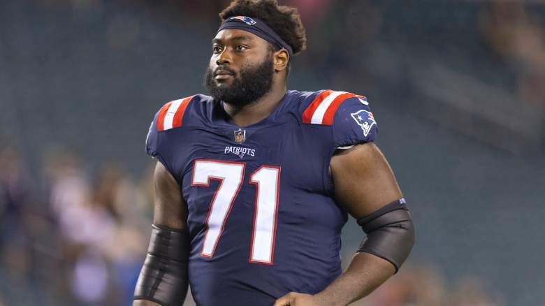 Mike Onwenu #71 of the New England Patriots walks off the field