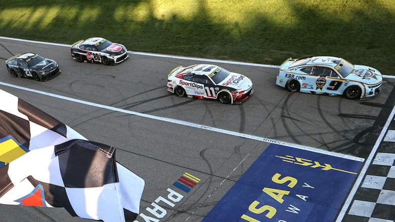 Chase Elliott, driver of the #9 Kelley Blue Book Chevrolet, takes the checkered flag