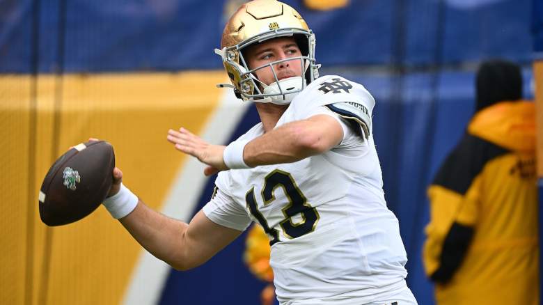 CJ Carr #13 of the Notre Dame Fighting Irish warms up