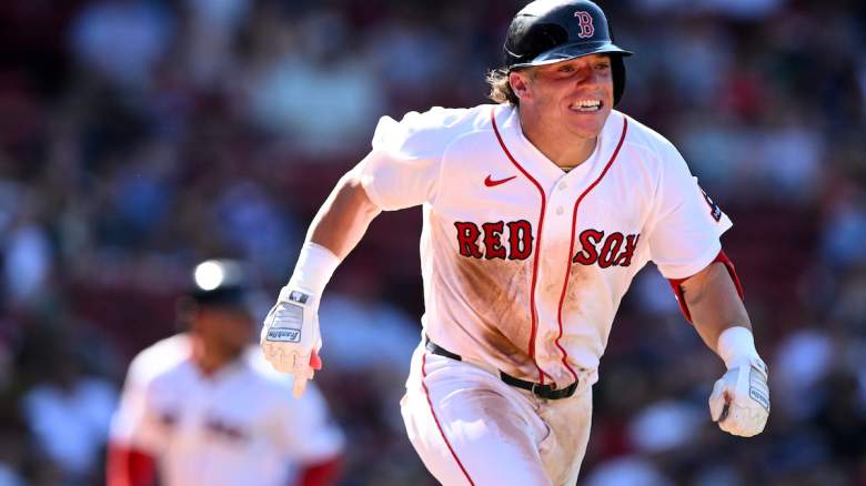 Nate Eaton #18 of the Boston Red Sox runs towards first base after hitting a RBI single