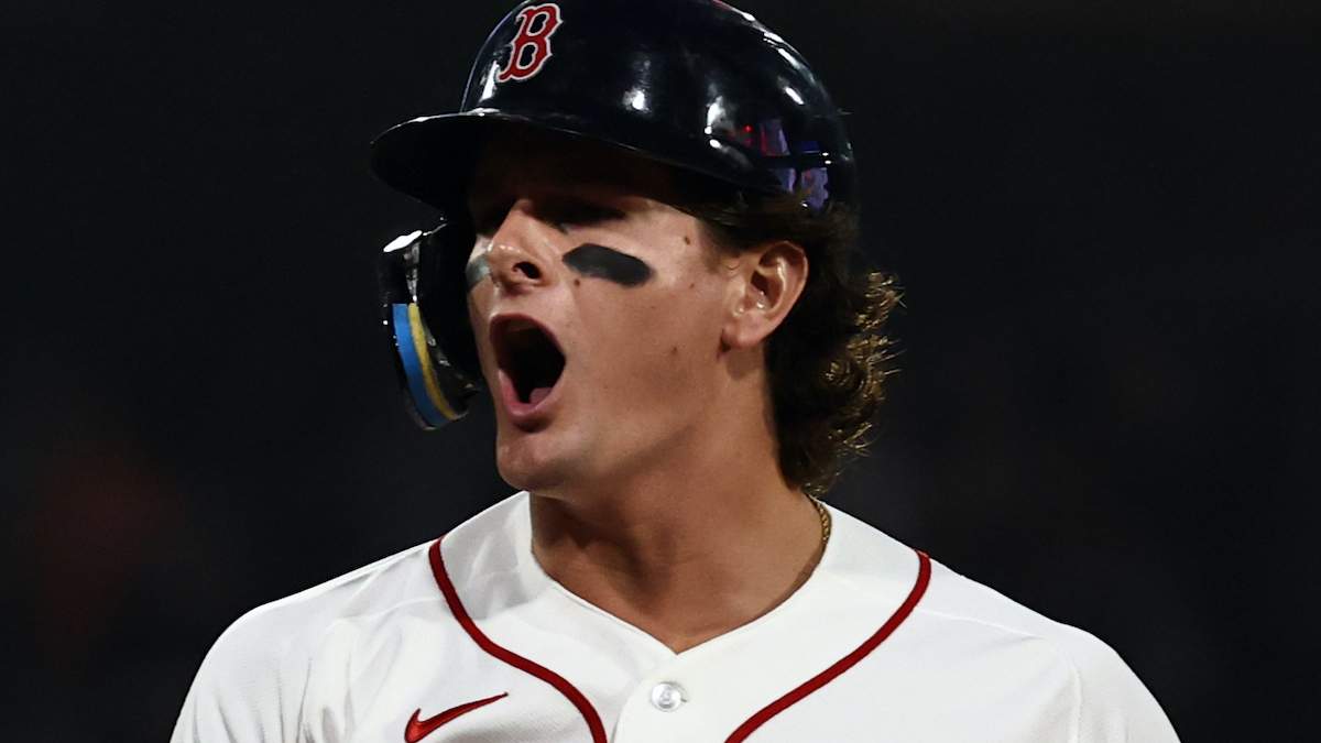 Roman Anthony #19 of the Boston Red Sox shouts out after his RBI single against the Kansas City Royals