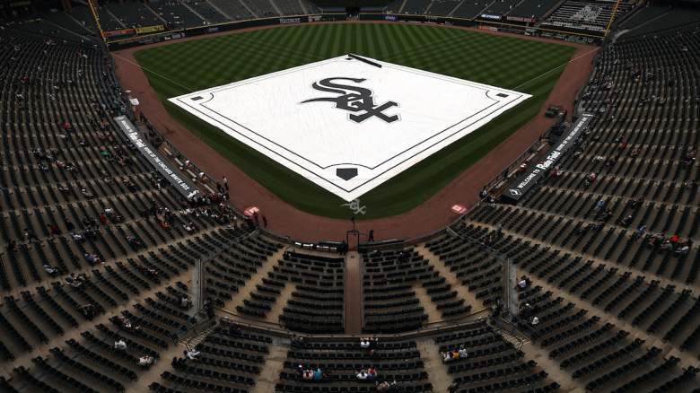The tarp is pulled over the diamond during a rain delay before a game at Rate Field.
