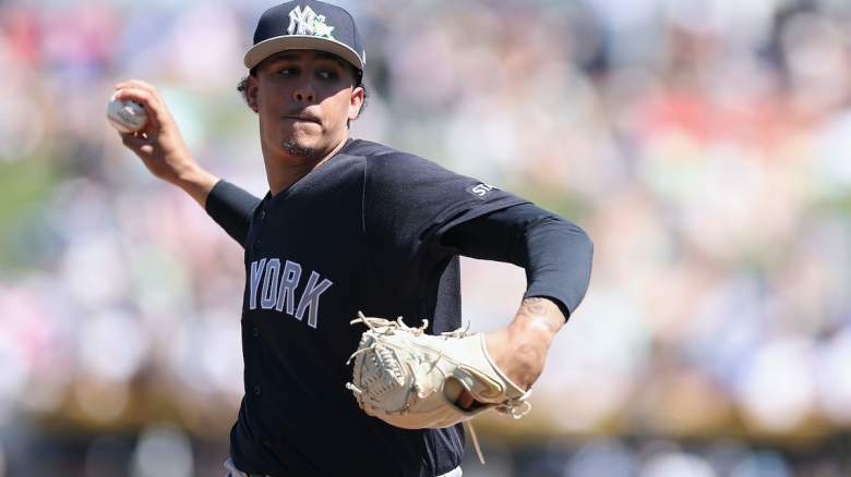 Starting pitcher Carlos Lagrange #84 of the New York Yankees throws a warm-up pitch