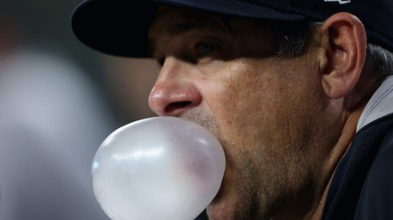 Manager Aaron Boone #17 of the New York Yankees watches from the dugout