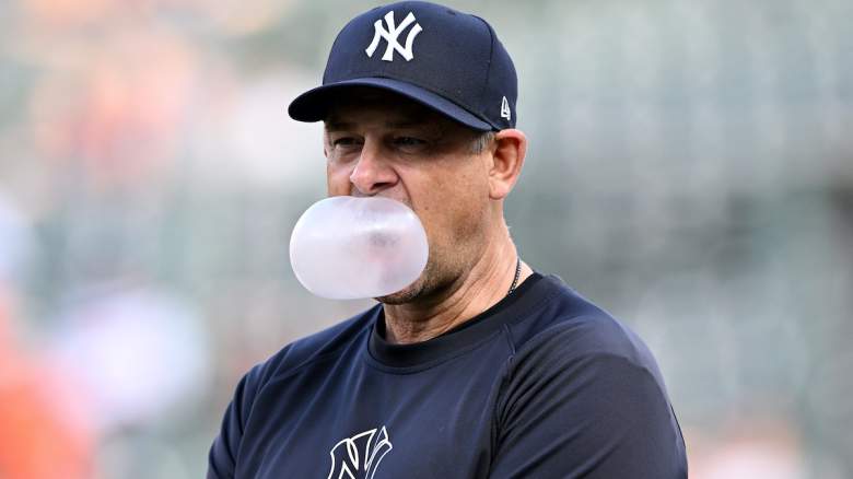Manager Aaron Boone #17 of the New York Yankees blows a bubble