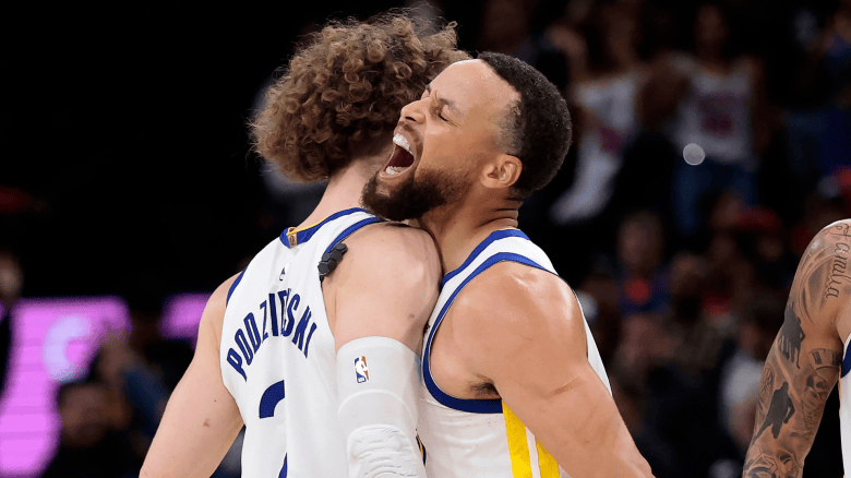 Brandin Podziemski and Stephen Curry