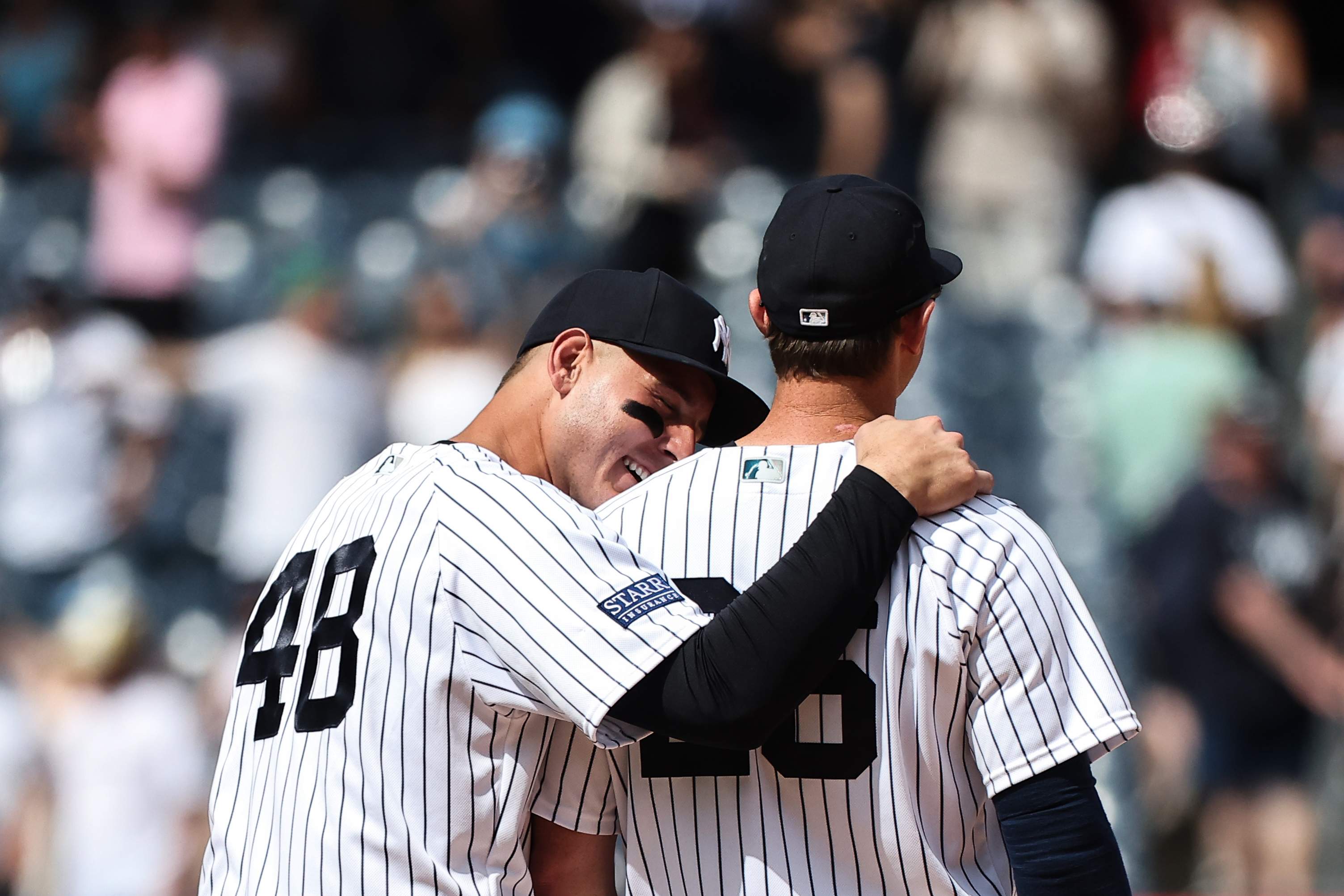 DJ LeMahieu of the New York Yankees waits in the dugout before a game against the Los Angeles Dodgers.