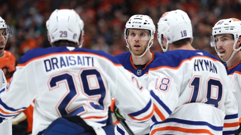 Ryan Nugent-Hopkins #93, Evan Bouchard #2, Zach Hyman #18 and Leon Draisaitl #29 congratulate Connor McDavid #97 of the Edmonton Oilers after his goal during the third period in Game Three of the First Round of the 2026 Stanley Cup Playoffs against the Anaheim Ducks at Honda Center on April 24, 2026 in Anaheim, California