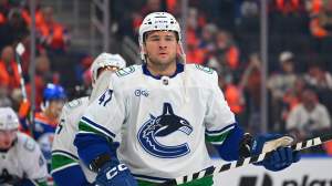 Paul Cotter #47 of the Vancouver Canucks in action during the game against the Edmonton Oilers at Rogers Place on September 29, 2026, in Edmonton, Alberta, Canada.