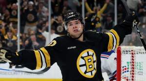 JJ Peterka #10 of the Boston Bruins celebrates after scoring against the New York Rangers during the third period of the Boston Bruins season home opener at TD Garden on September 29, 2026 in Boston, Massachusetts. The Bruins defeat the Rangers 3-0.