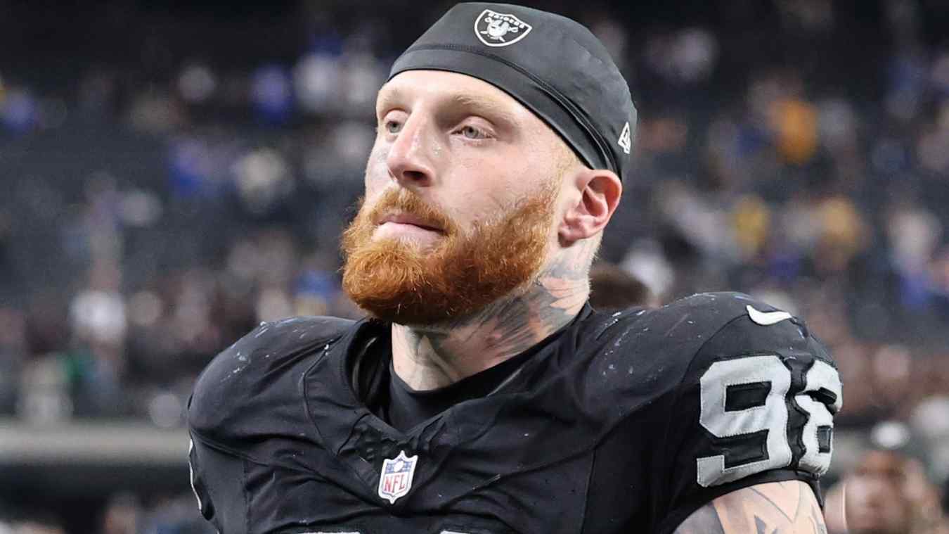Maxx Crosby #98 of the Las Vegas Raiders remains connected to the Cowboys