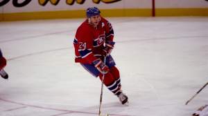 Defenseman Lyle Odelein of the Montreal Canadiens moves the puck against the Pittsburgh Penguins during a game played at the Civic Arena in Pittsburgh, Pennsylvania. The Canadiens won the game, 4-2.