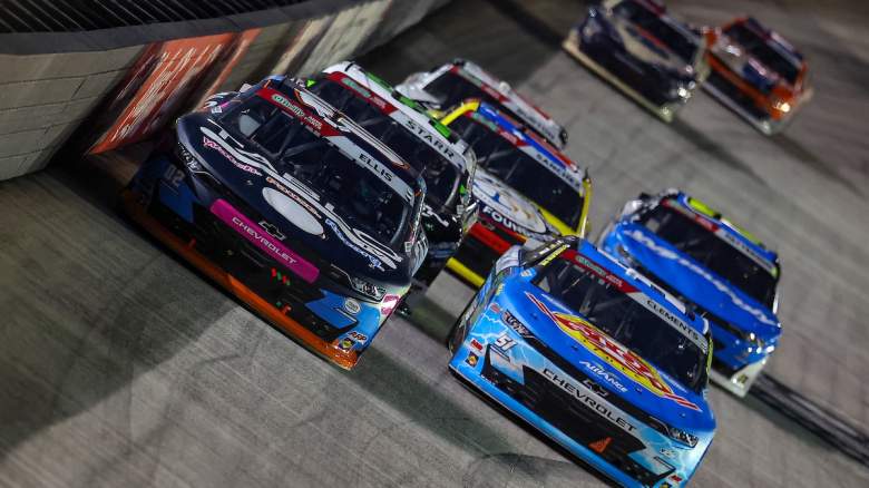 NASCAR cars race on a track