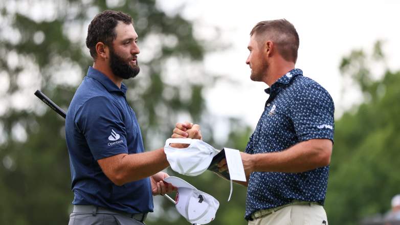 Jon Rahm and Bryson DeChambeau shake hands during LIV Golf Greenbrier in 2024