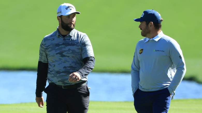 Jon Rahm and Louis Oosthuizen walk together during the 2022 Players Championship