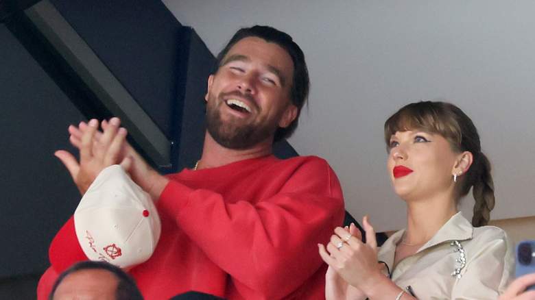 Travis Kelce, left, and Taylor Swift react as the Edmonton Oilers and the Florida Panthers play during the first period in Game Four of the 2025 Stanley Cup Final at Amerant Bank Arena on June 12, 2025