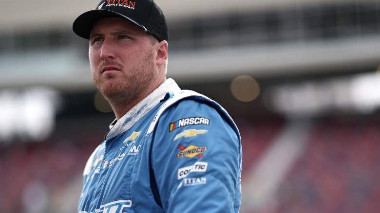 Austin Hill, driver of the #21 Titan Chevrolet, looks on during qualifying