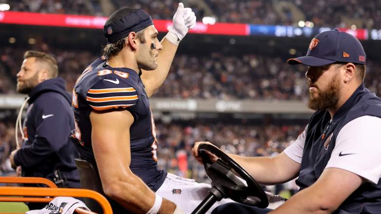 Cole Kmet #85 of the Chicago Bears is carted off the field