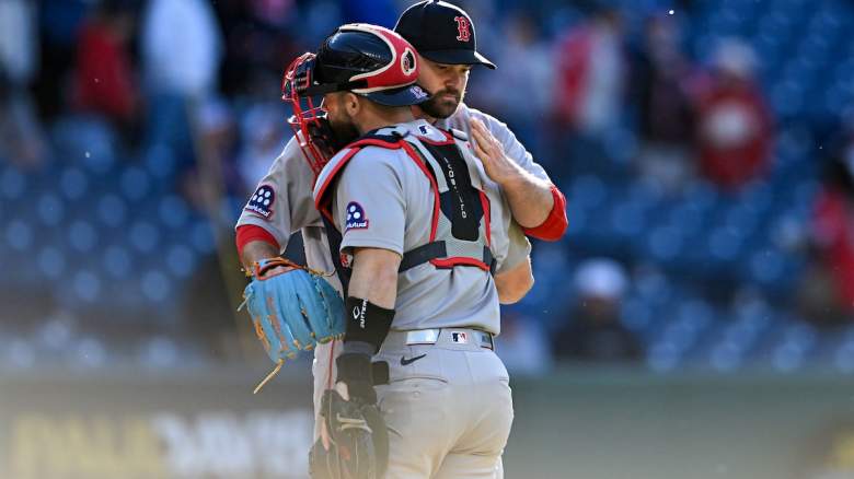 Danny Coulombe #67 and Connor Wong #12 of the Boston Red Sox celebrate