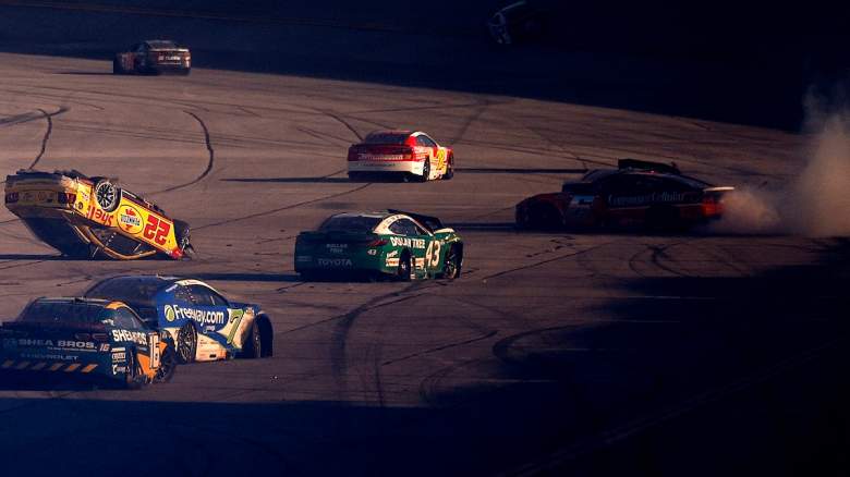 Joey Logano, driver of the #22 Shell Pennzoil Ford, sits flipped over after an on-track incident during the NASCAR Cup Series YellaWood 500 at Talladega Superspeedway on October 25, 2026 in Talladega, Alabama.