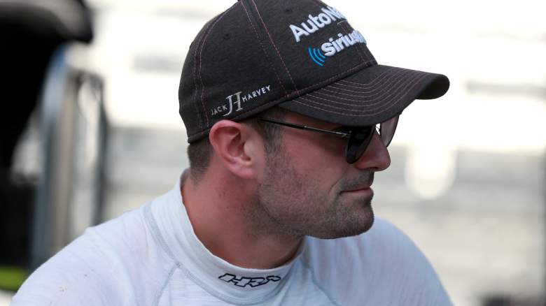 Jack Harvey of England, driver of the #60 AutoNation/SiriusXM Meyer Shank Racing Honda, waits in the garage area