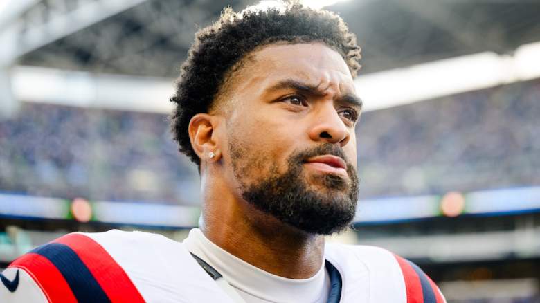 Dre'mont Jones #5 of the New England Patriots looks on