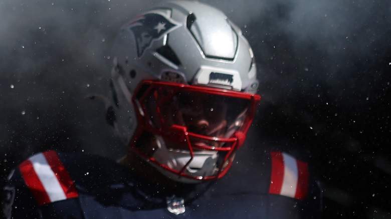 Alijah Vera-Tucker #75 of the New England Patriots walks out of the tunnel