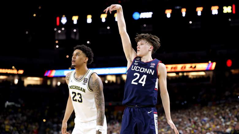 UConn basketball guard shooting a three