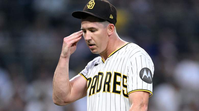 Walker Buehler #10 of the San Diego Padres walks to the dugout