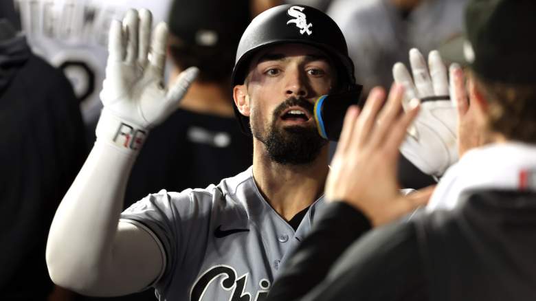 Randal Grichuk #34 of the Chicago White Sox is congratulated by teammates